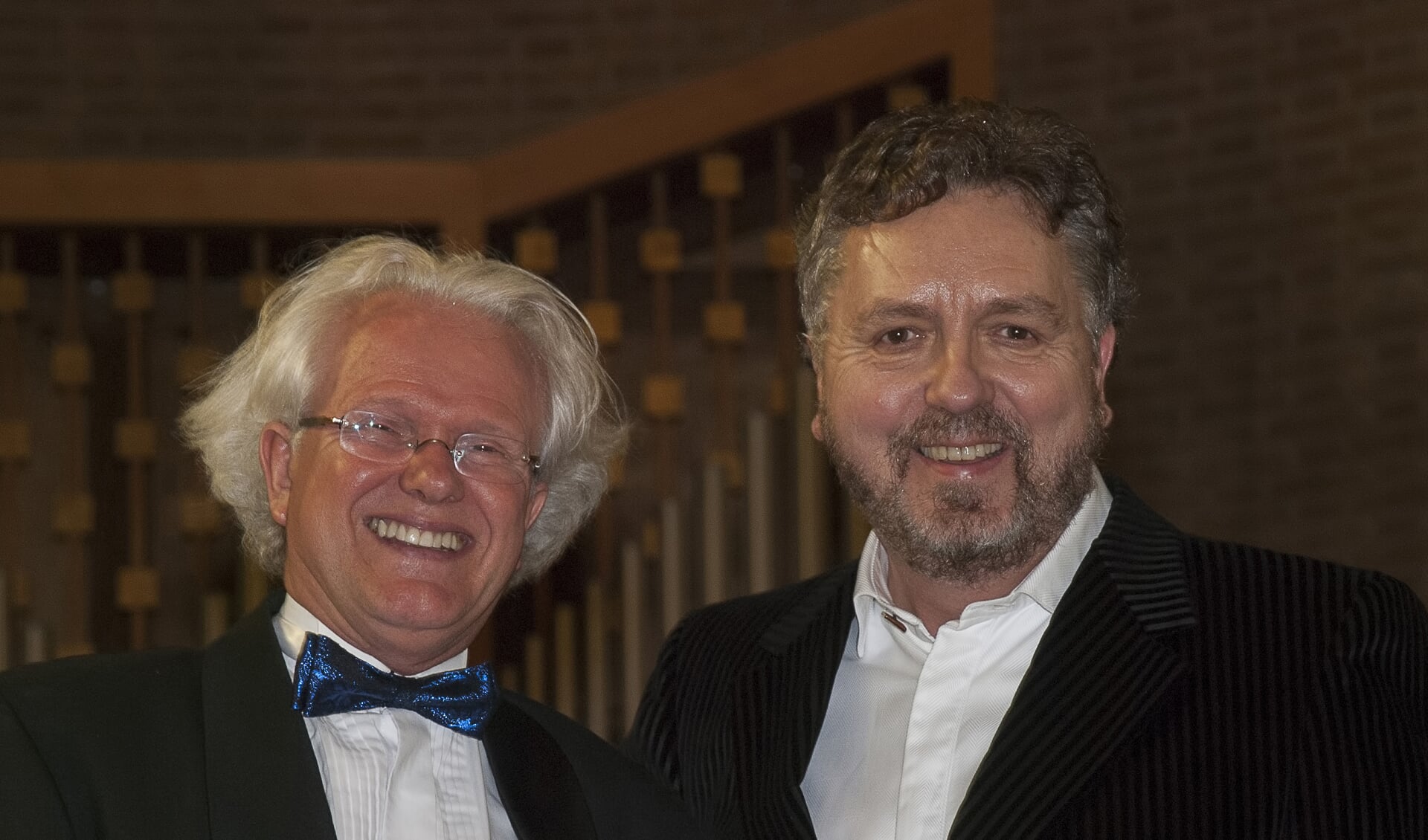 De tenor Christian Polus (rechts) met dirigent Emile Engel. Foto Ans ter Horst