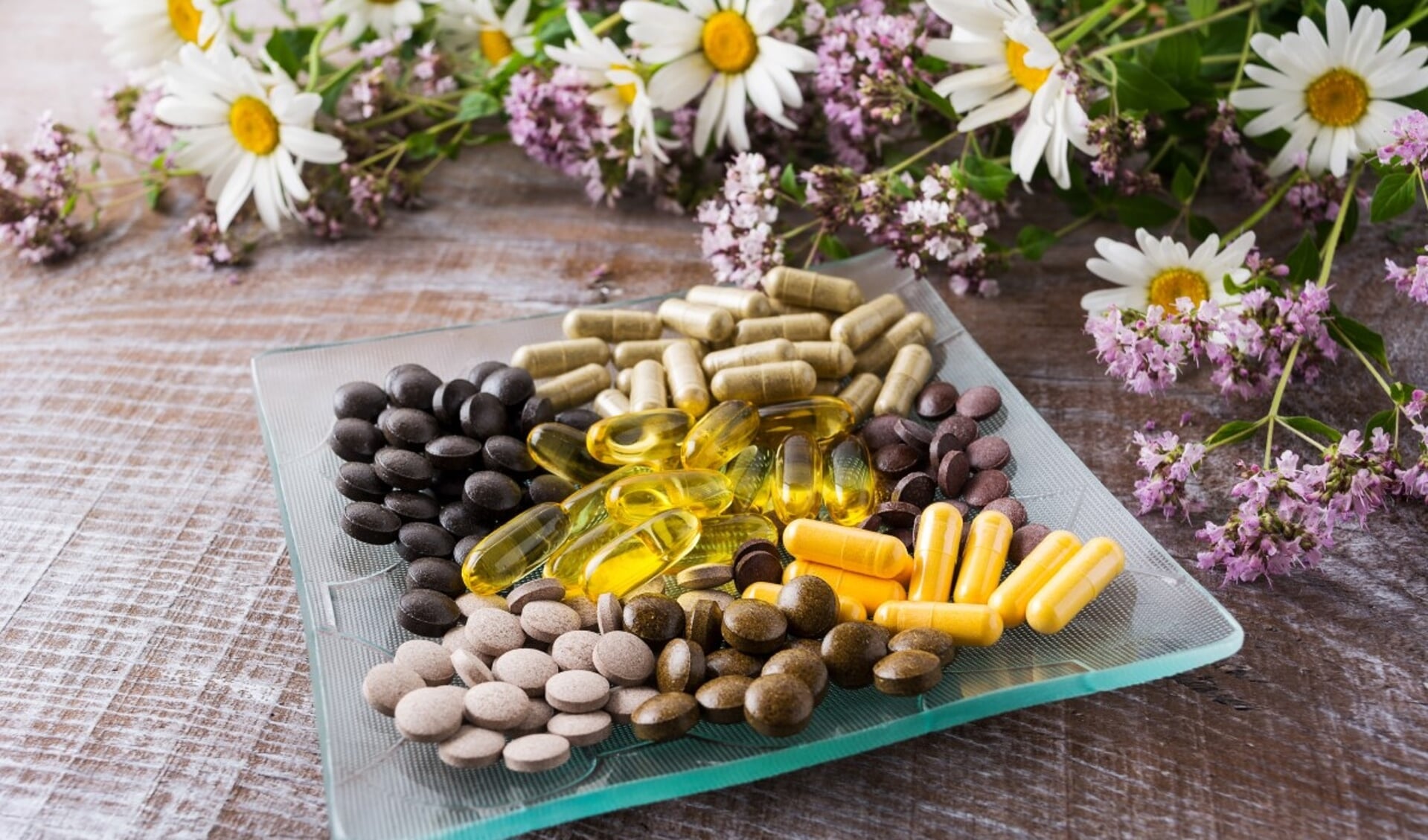 Ayurvedic pills with chamomile and tansy flowers