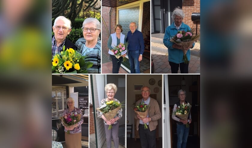 Een aantal 75-plussers die de bloemen in ontvangst mochten nemen.