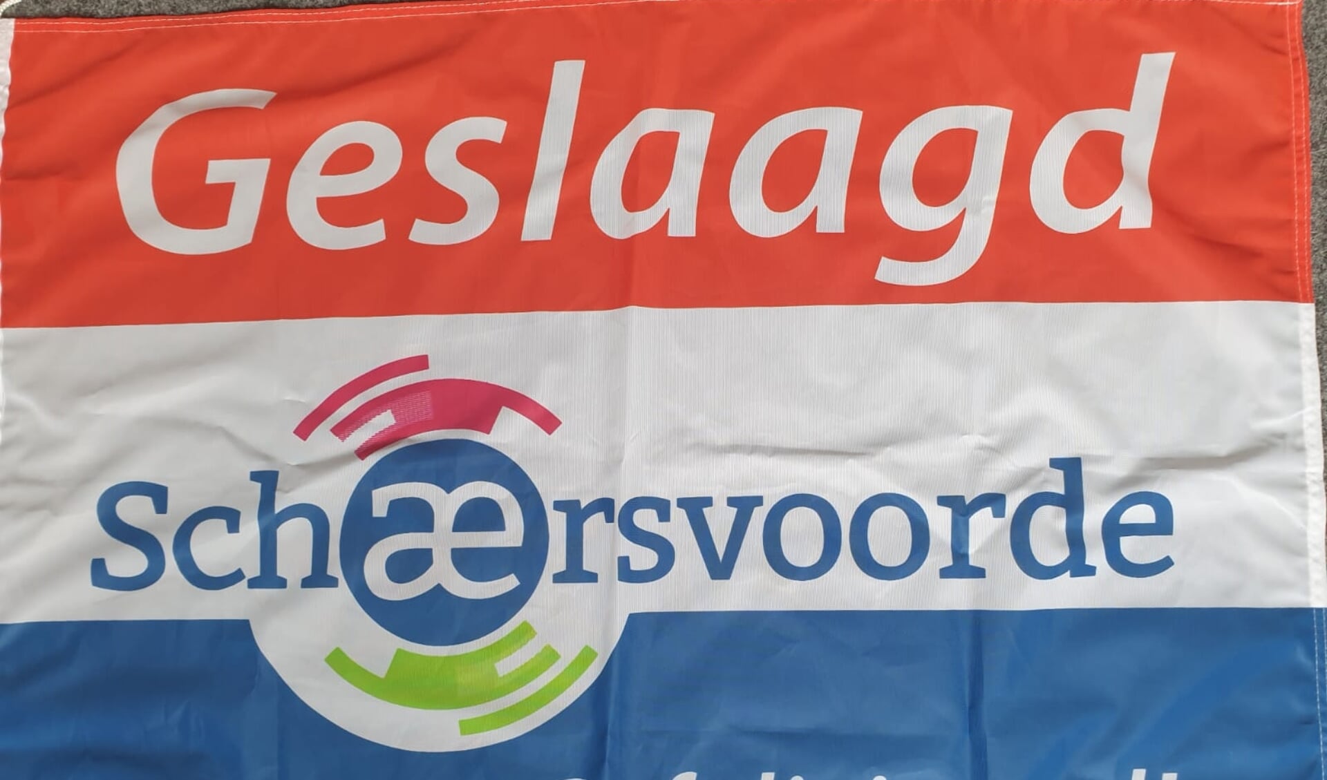 De speciale vlag die alle geslaagde Schaersvoorde-leerlingen ontvingen. Foto: PR