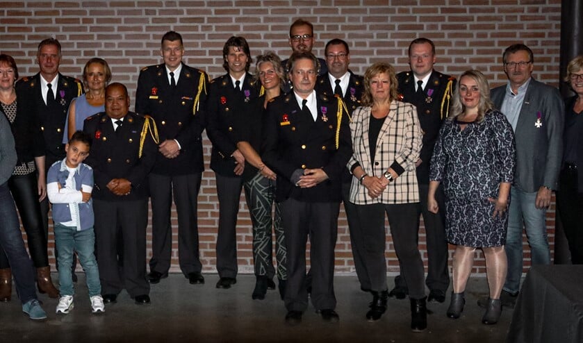 De jubilarissen en hun familie.