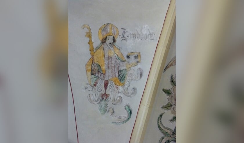 Bisschop Radboud, die in het Latijn over de zwaluw dichtte, op een muurschildering in de voormalige Broerenkerk in Zwolle, waarin nu boekhandel Waanders is gevestigd. Foto: Dries van den Akker s.j.