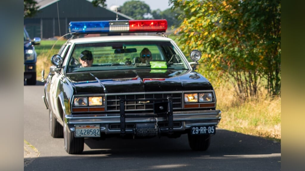 Ook een heuse Amerikaanse politiewagen ging mee in de stoet. Foto: Marcel te Brake