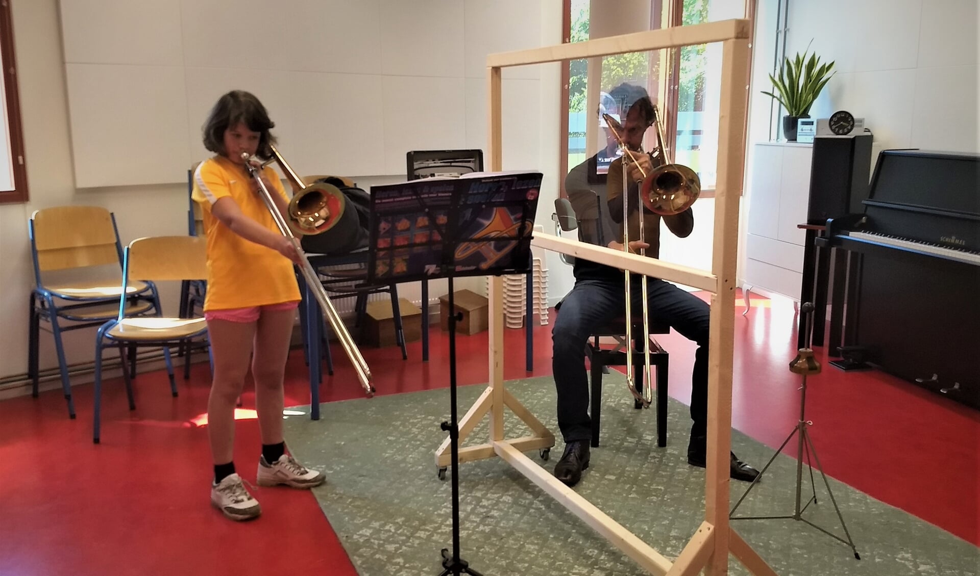 Ruud Pletting, trombonedocent en Judith, 9 jaar, tromboneleerling