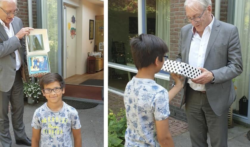 Jayden de Vies kwam Hans Romeyn feliciteren met een heuse taart.