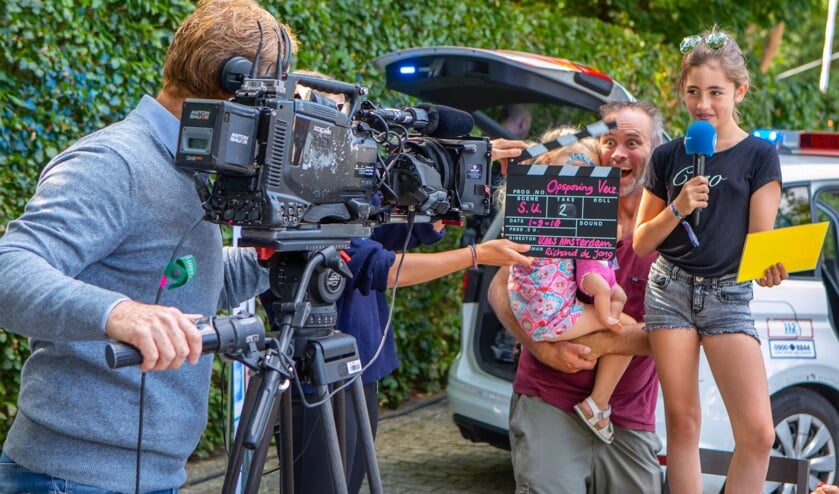 Bezoekers staan dit keer voor de camera.