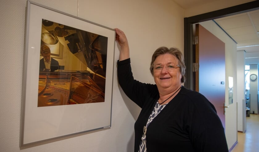 Carla koos zelf deze foto van een pianospeler die mooi reflecteert in de vleugel.