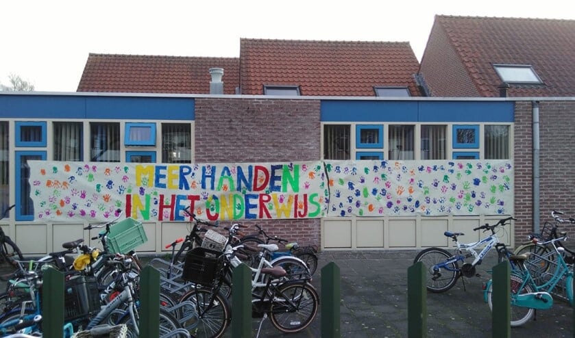 Bij de Ark hing een door de kinderen gemaakt spandoek.