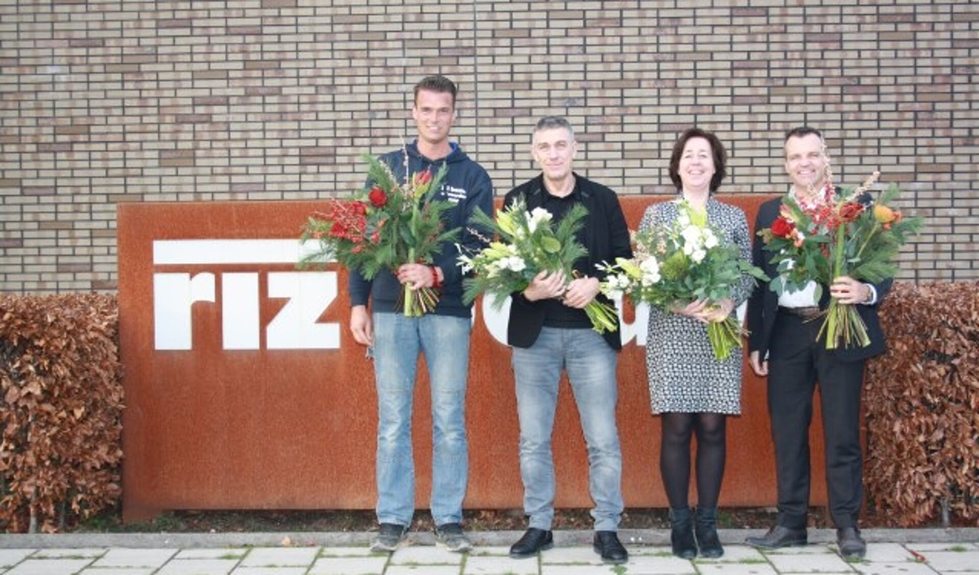 De vier jubilarissen bij riz bouw, vlnr Pascal Sangers, Wim van Ziel, Joke van Kesteren-Oorbeek, Wim Timmer