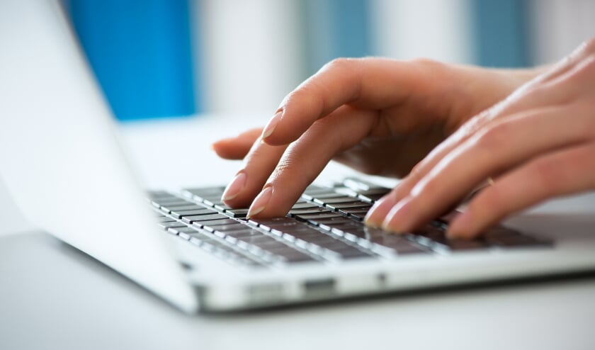 Closeup of businesswoman typing on laptop computer