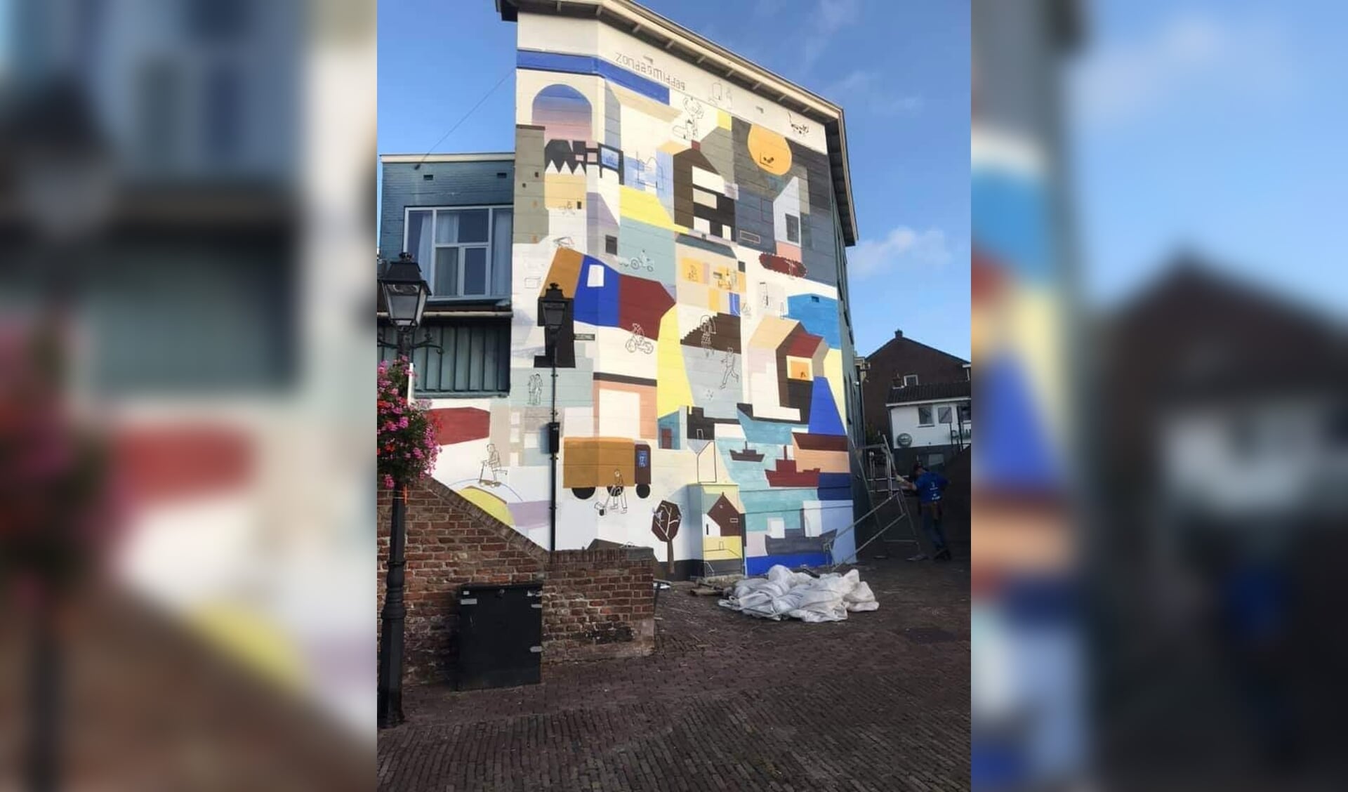 • Foto van de muurschildering via Facebook Nieuw Leerdam, Marije van Schelven.