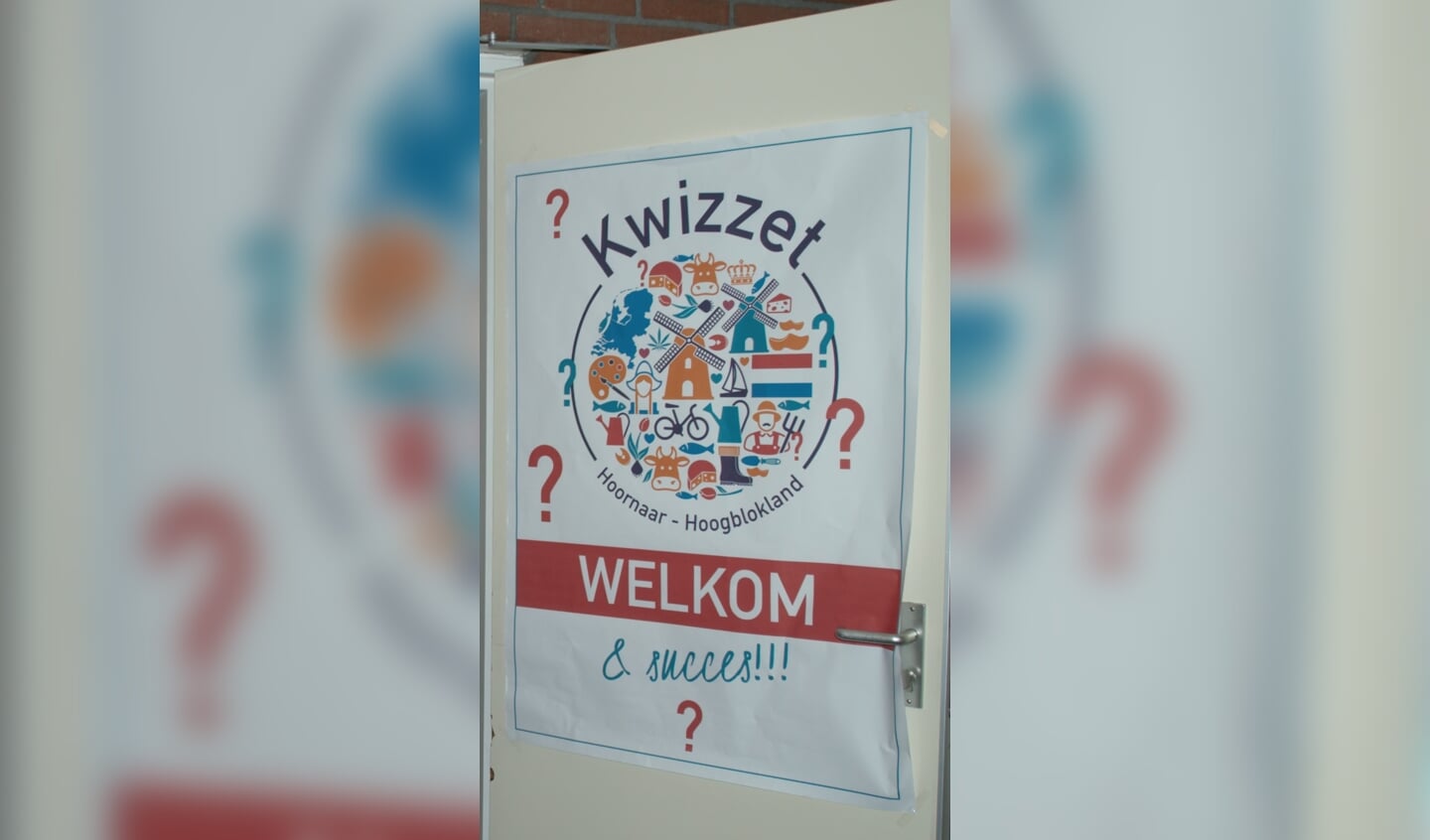 Het Kwizzet logo hing bij binnenkomst op de deur