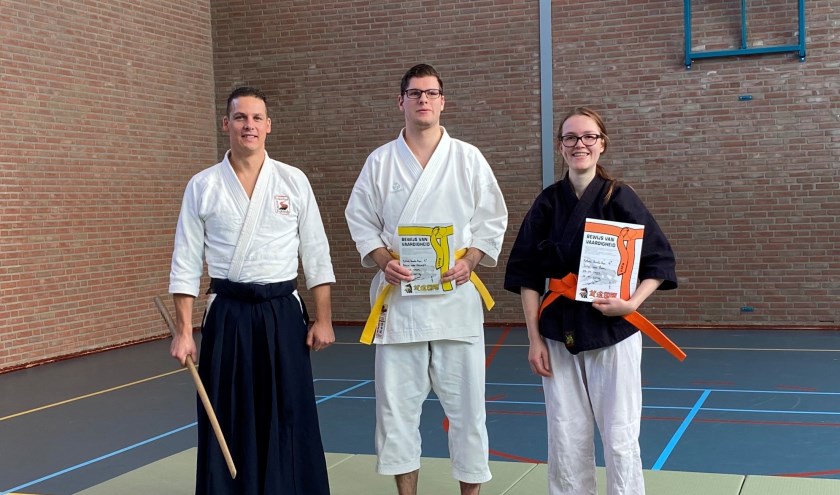 • Docent Joost en geslaagden Kevin en Julia.