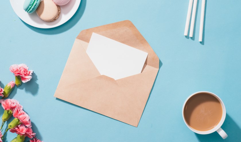 Envelope or letter for greeting text and gift box. Top view. Flat lay.