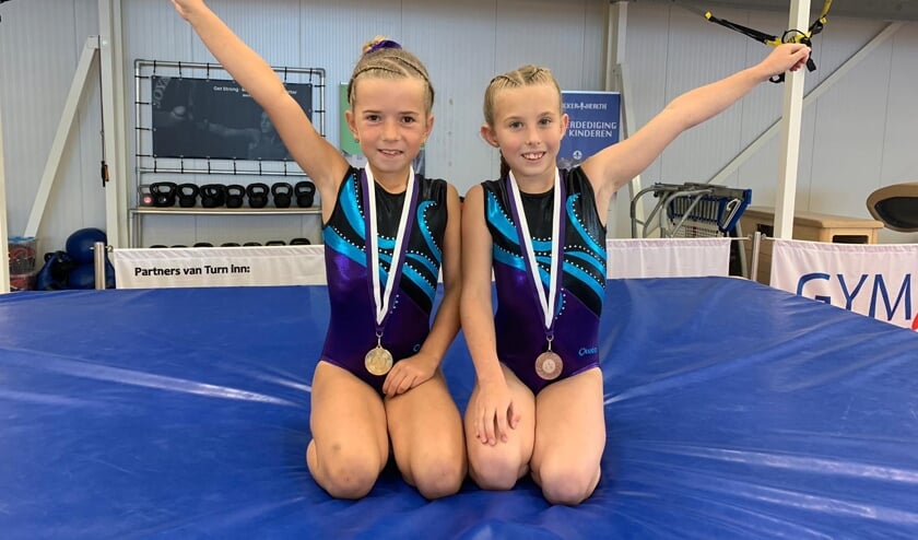 • Op de fo• Regiokampioen Amy Binneveld met rechts Indy van der Krift (brons).