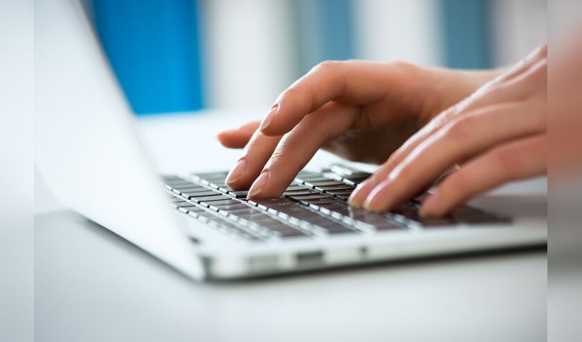 Closeup of businesswoman typing on laptop computer