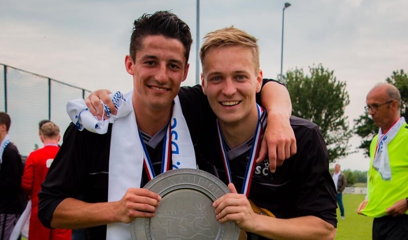 • Tim Coset (rechts op de foto).