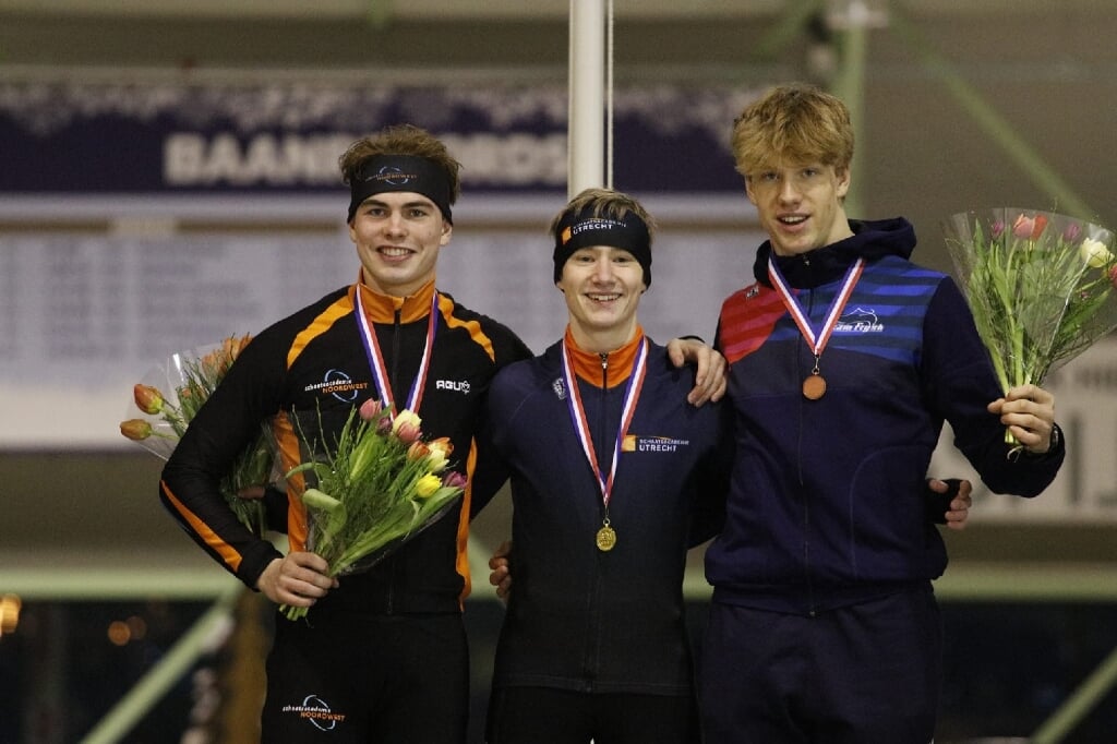 • Niels de Kruijk (midden) als Nederlands kampioen.