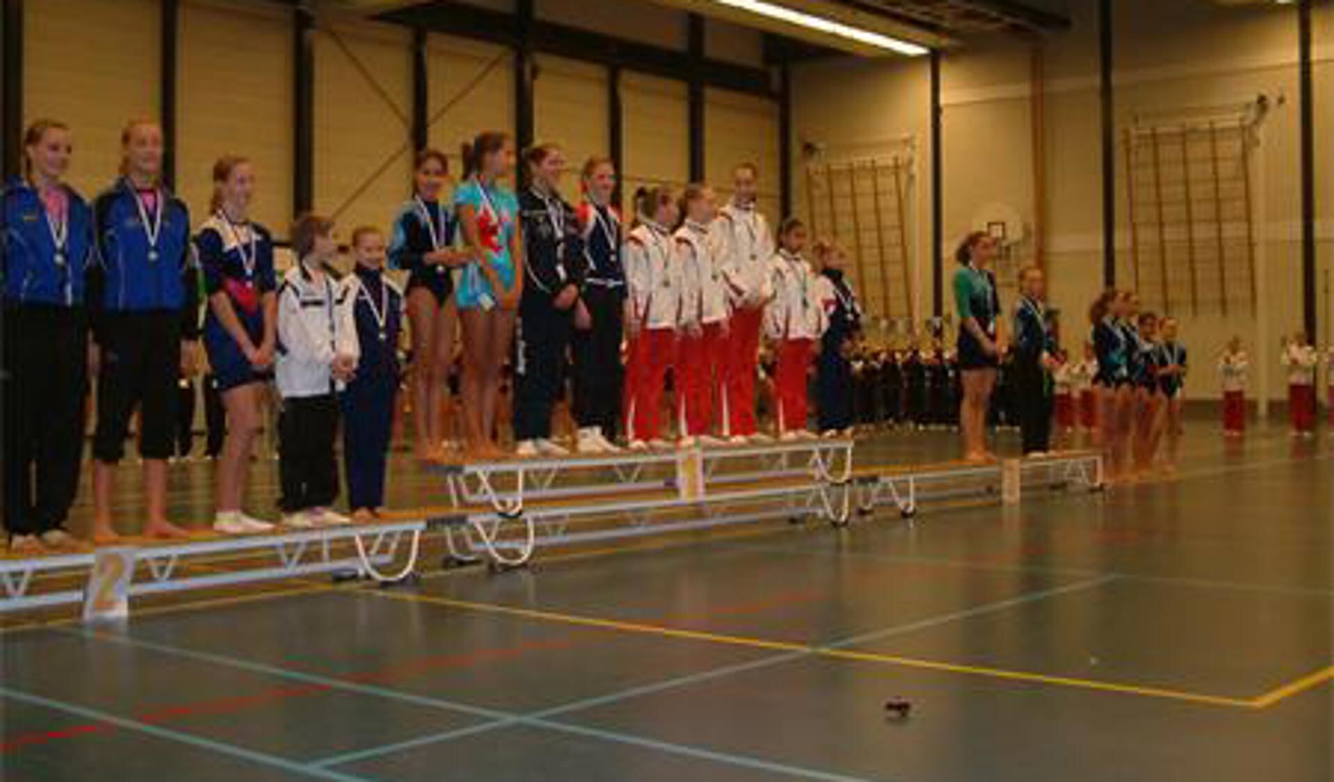 Helden op het podium.