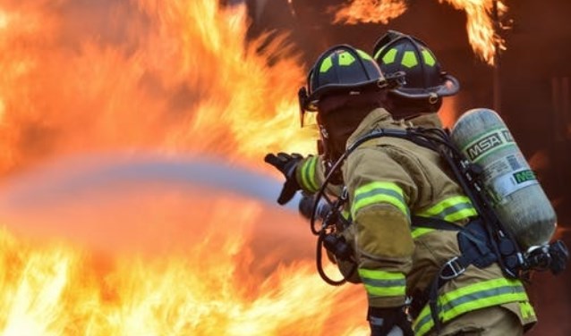 Negen Helderse brandweerlieden onderscheiden.