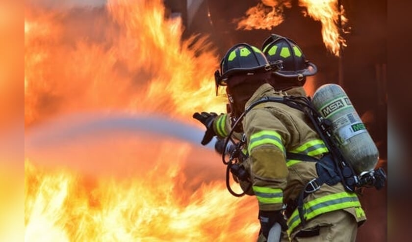 Negen Helderse brandweerlieden onderscheiden.