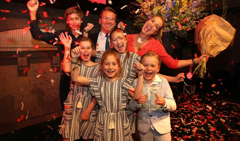 Laura (rechtsboven) met haar familie.
