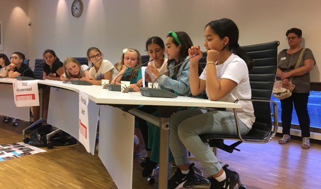 De kinderen namen de kinderconferentie serieus.