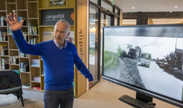 Historische vereniging Langedijk, foto-expositie in De Binding. Piet van Kleef is er maar druk mee.
