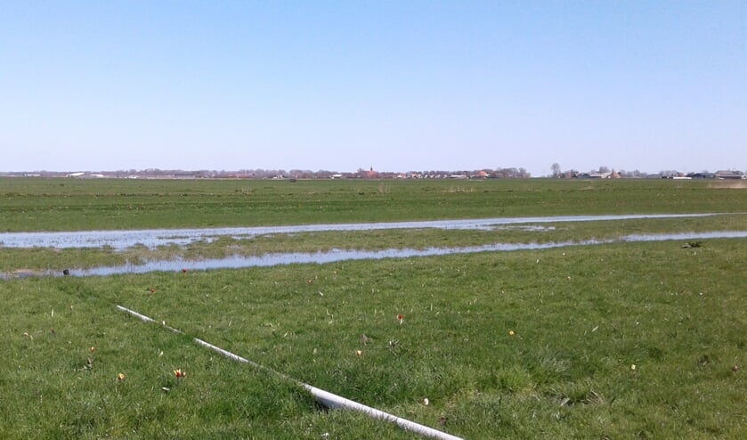 Perceel dat onder water wordt gezet.