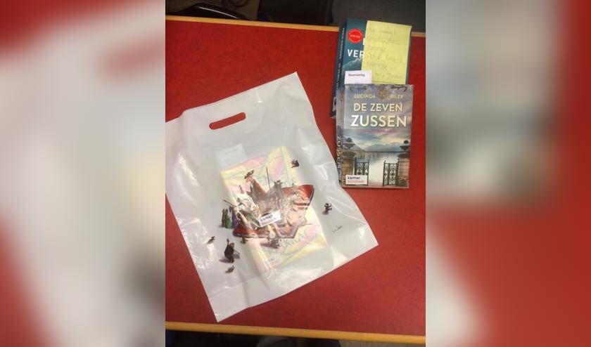 Karmac brengt boeken aan huis.