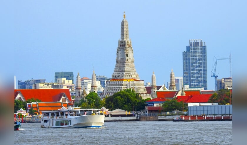 De Chao Praya River is het kloppend hart van Bangkok. Op de oever de fameuze tempel van Wat Arun. (Foto’s Eric Korver/NGM)