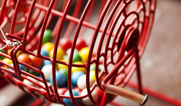 red raffle game with different colored balls for bingo and lottery games