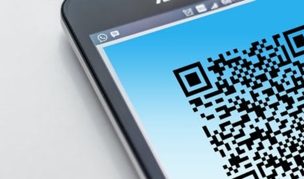 Dit jaar collecteert Amnesty met een poster met daarop een QR-code.