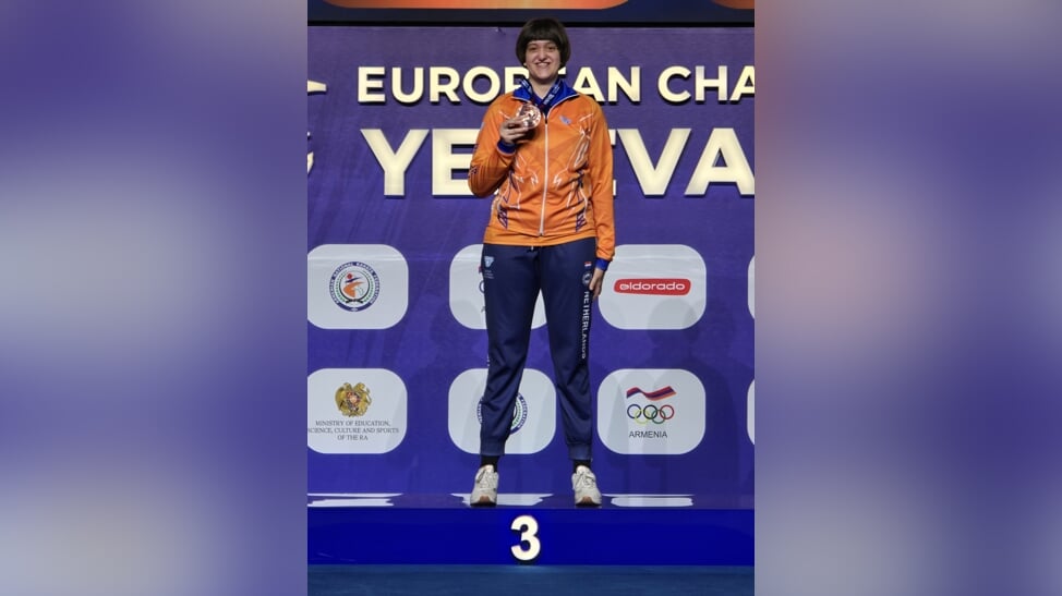 Een stralende bronzen medaille winnares Elise.