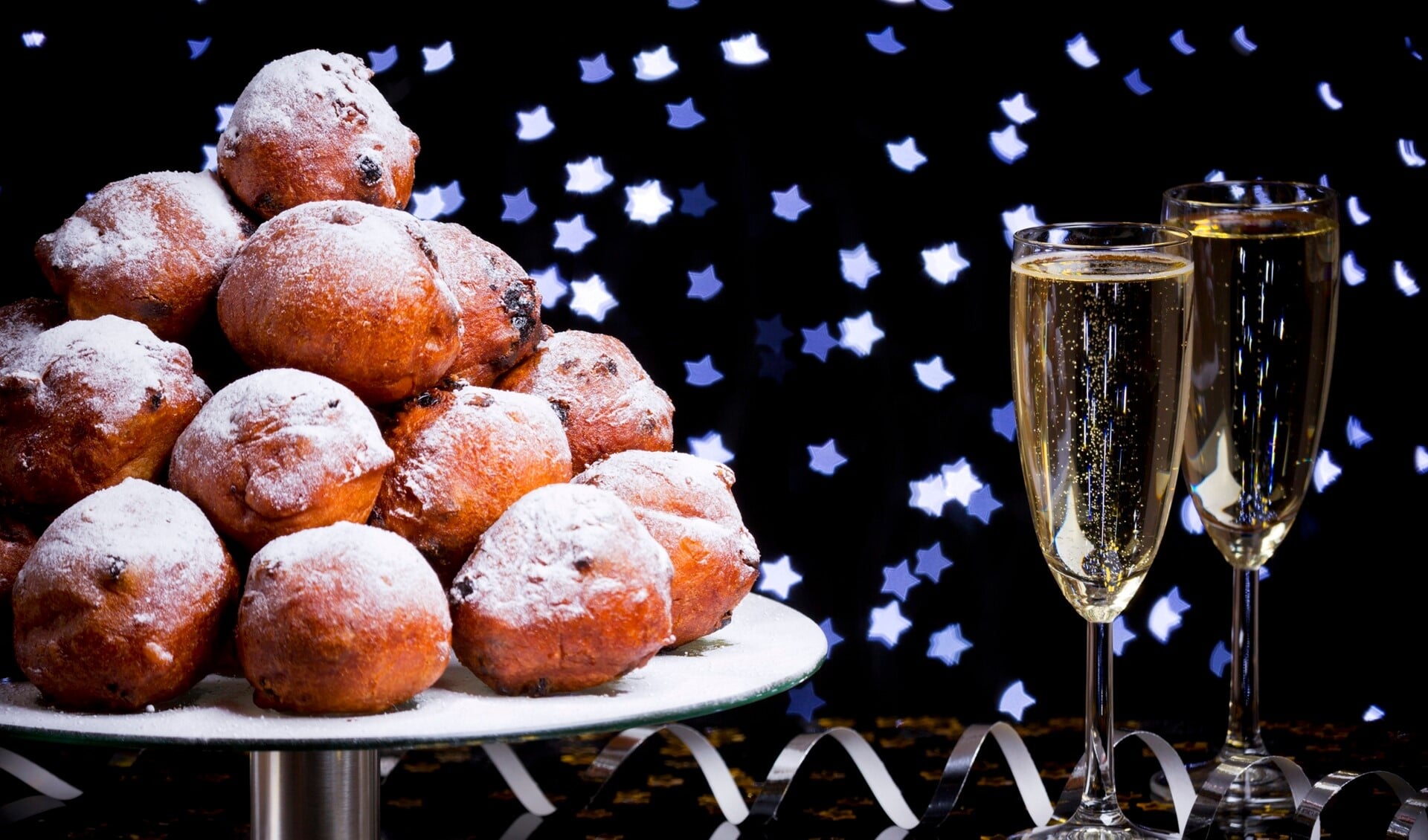 'Oliebollen', traditional Dutch pastry for New Year's Eve and two glasses of champagne.