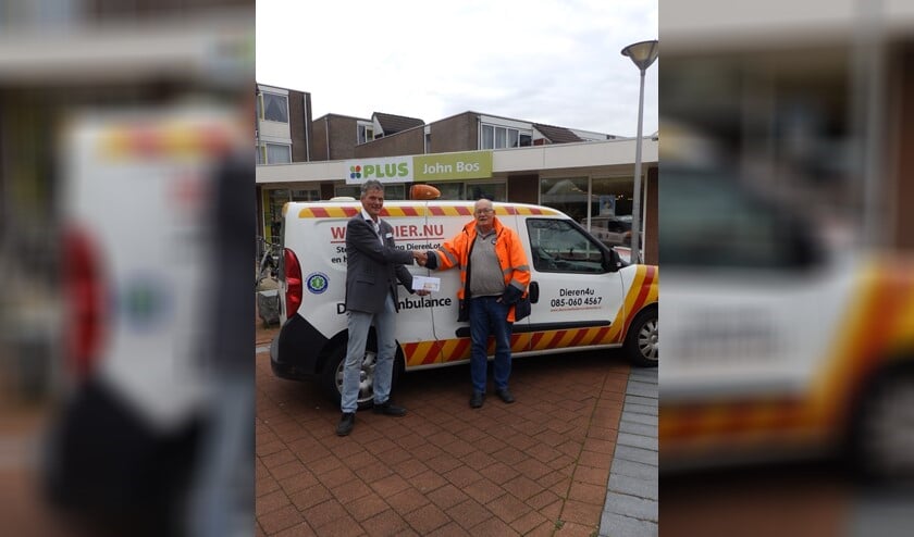 <p>De overhandiging van de cheque</p>