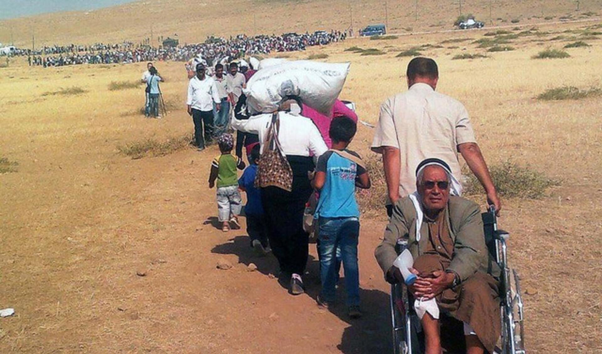 Vluchtelingen bij de Turkse grens met Irak