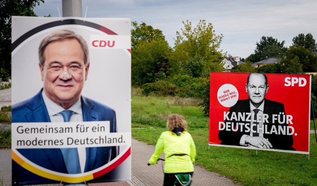 Armin Laschet (CDU) og Olaf Scholz (SPD) mener begge, at de bør stå i spidsen for en kommende tre-parti-regering sammen med De Grønne og FDP. (dpa)