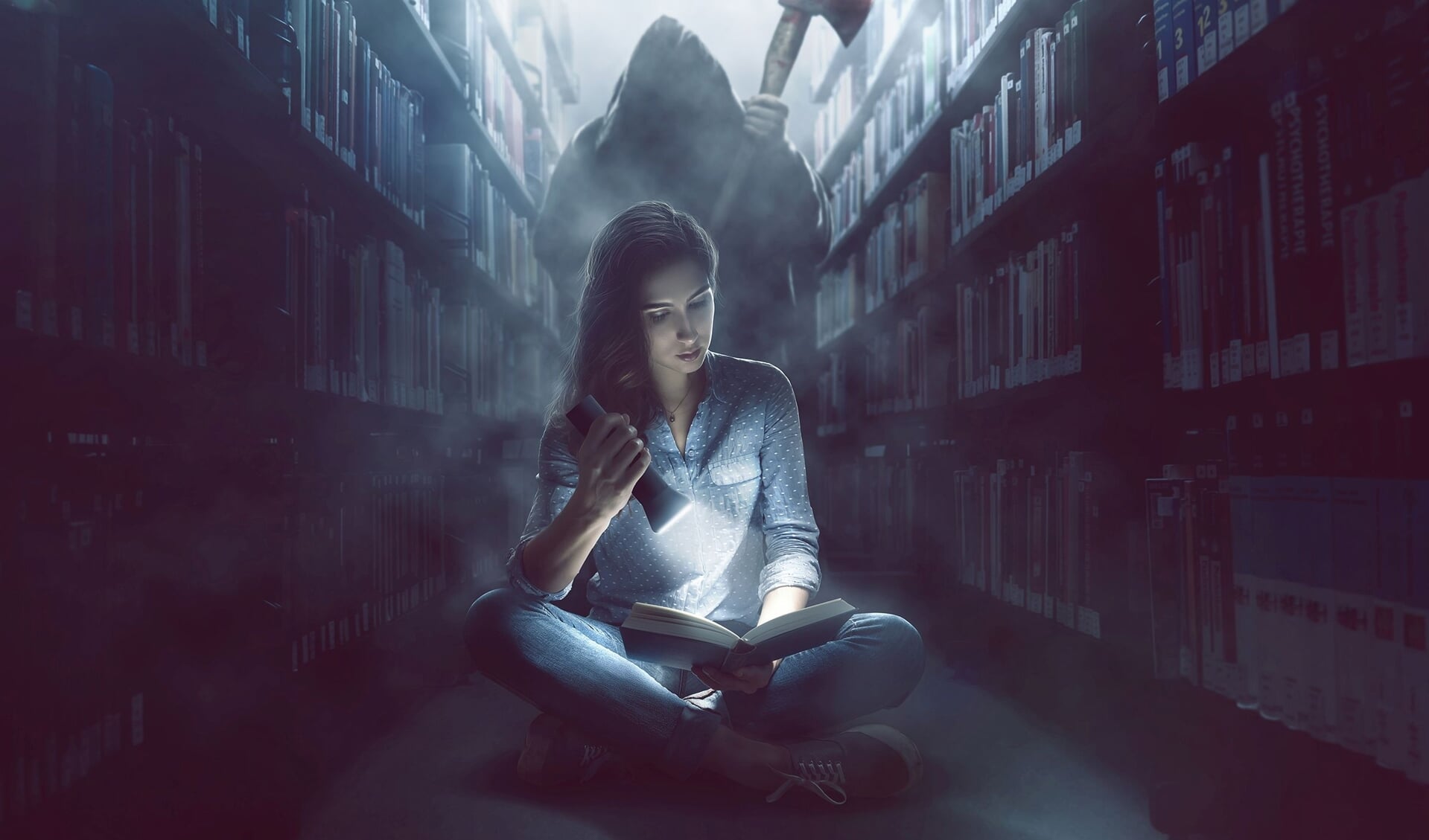 Woman reads a book in dark library