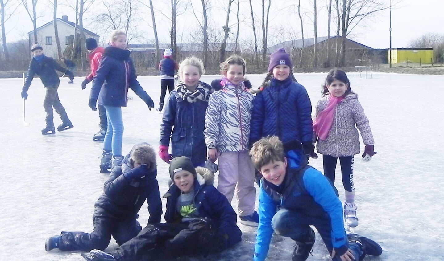 Deze kinderen hadden het erg naar hun zin op het ijs.