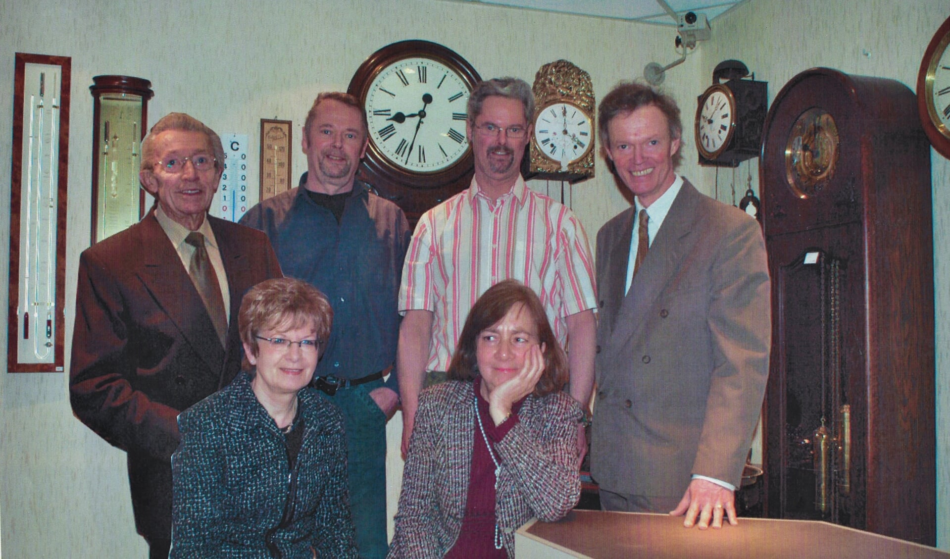 Vader en de drie broer Post met het personeel in 2006. Astrid ontbreekt op de foto.
