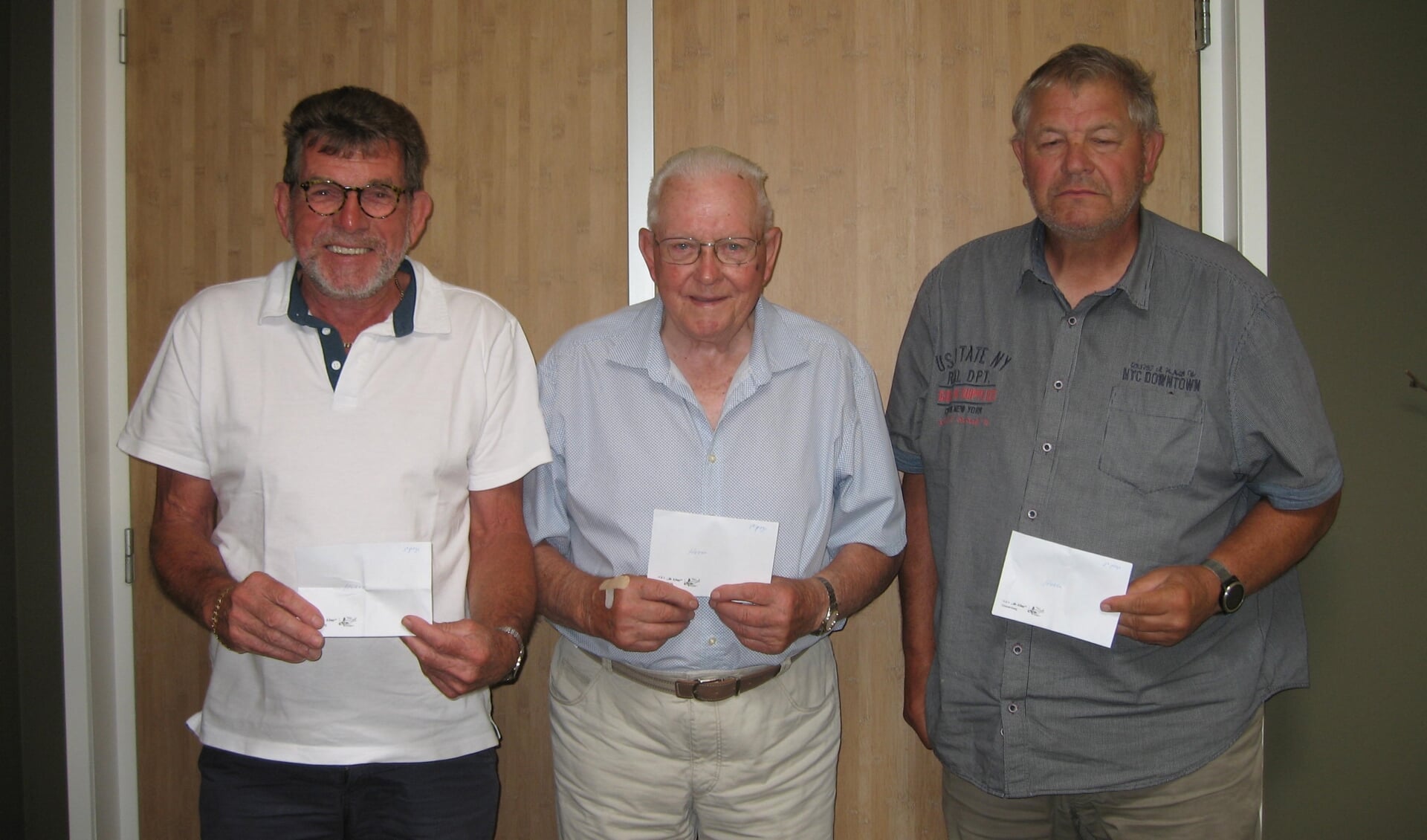 links: 3e E. Hartog, 1e Vas Rietveld, 2e C. Schot, winnaars heren