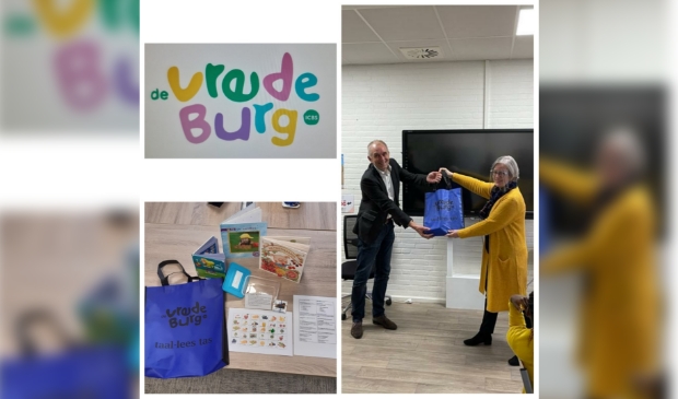 Eef?Niezing?ontvangt de?eerste?taal-leestas?en?de inhoud van de tas.? ?