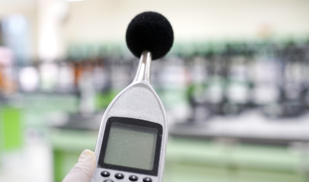 <p>Measuring the noise in laboratory room with a sound level meter.</p>