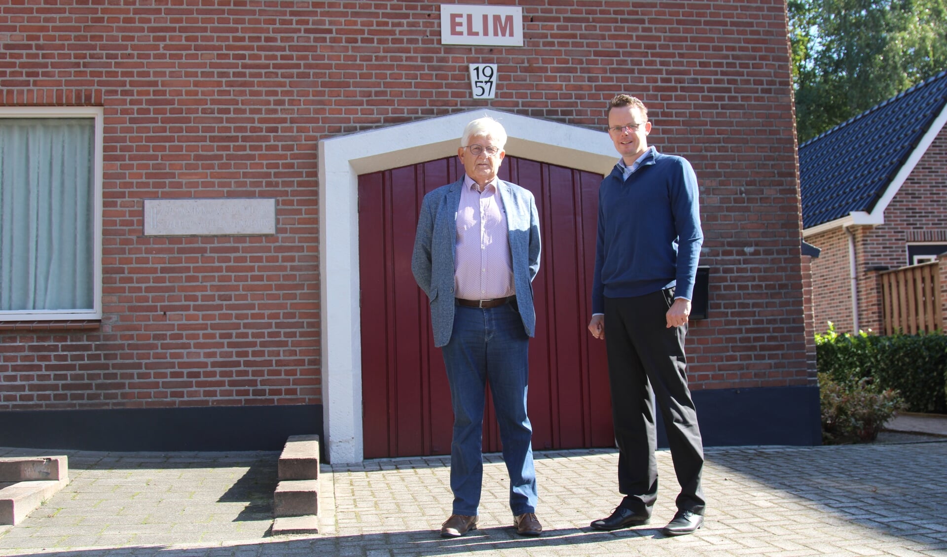 Evert Sneller (links) en dominee Post.