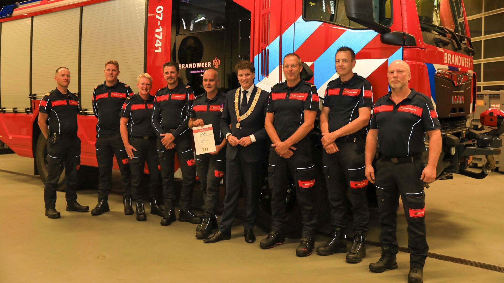 Groepsfoto tijdens de jaarvergadering van brandweer Barneveld.
