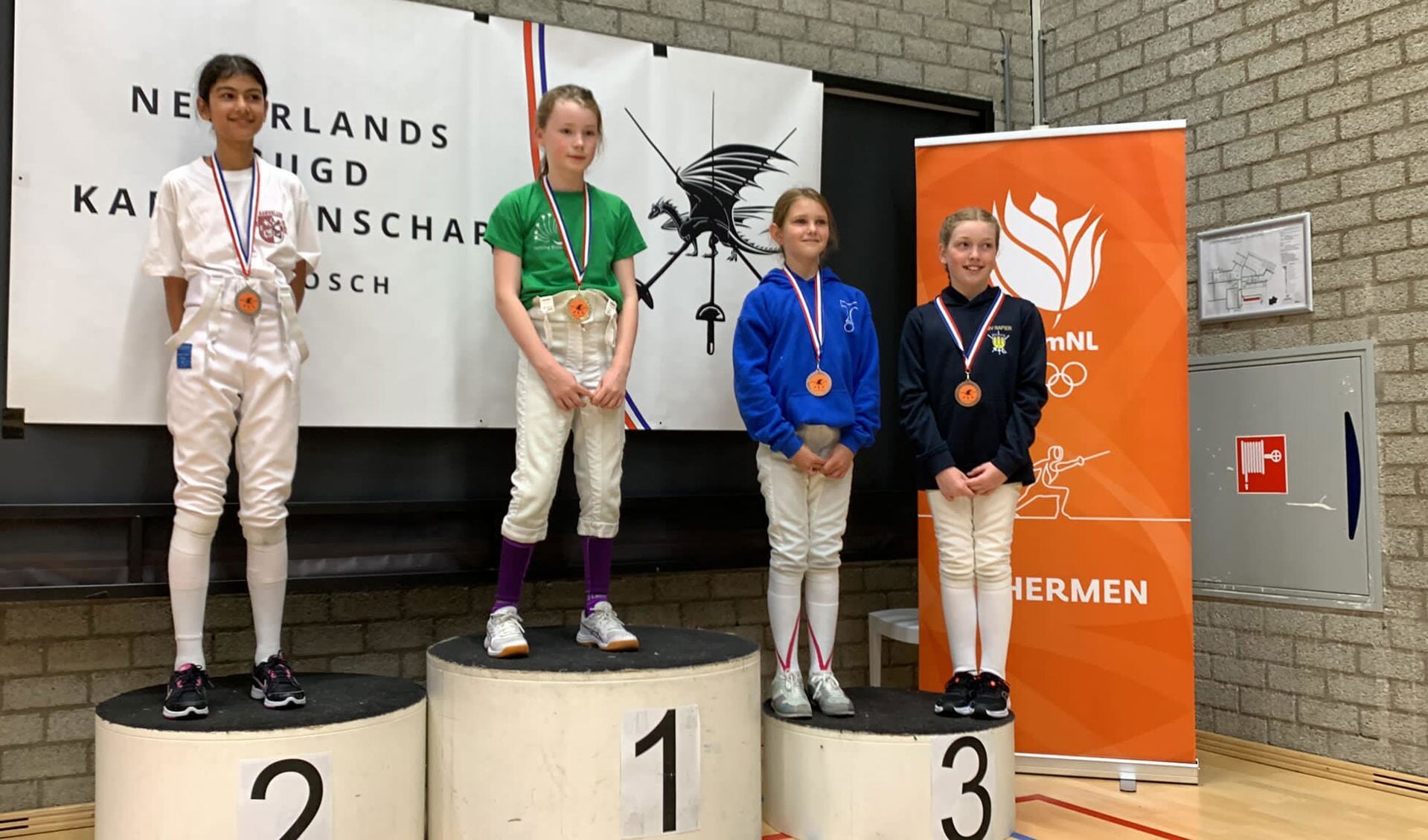Vera Wapenaar (nr 1) op het podium na de finale van het NJK in Den Bosch.