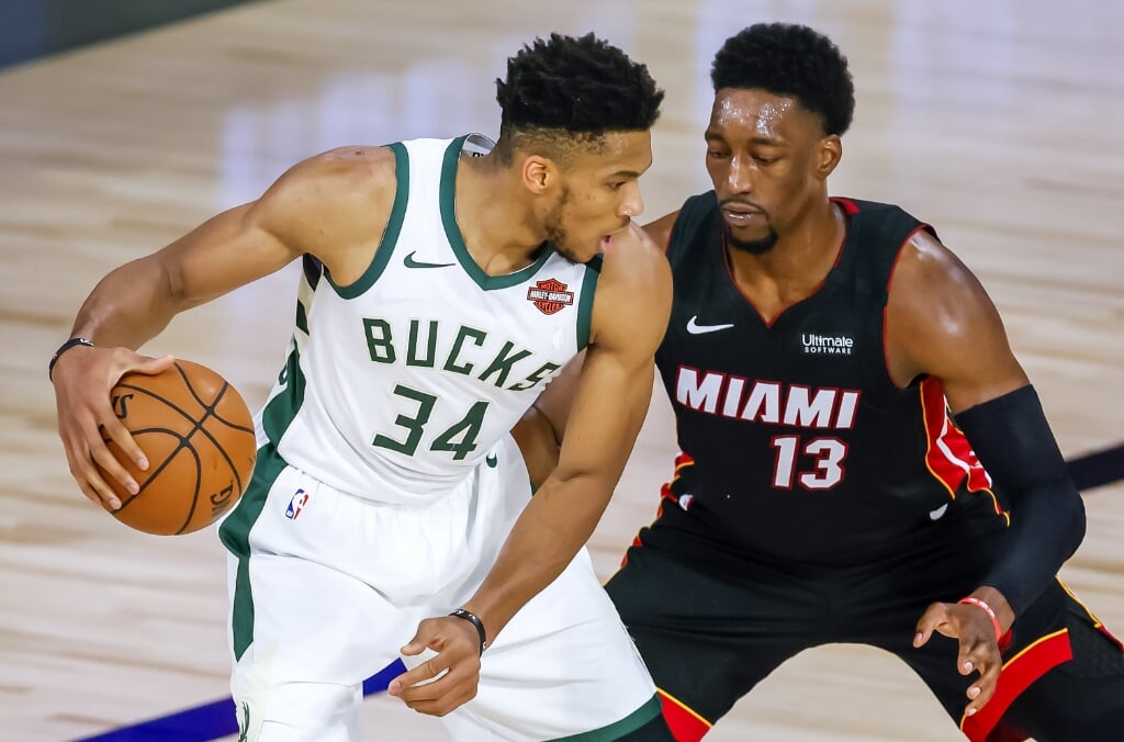 2020-09-04 18:34:49 epa08647876 Milwaukee Bucks forward Giannis Antetokounmpo of Greece (L) in action against Miami Heat forward Bam Adebayo (R) during the first half of the NBA basketball semifinal Eastern Conference playoff game three between the Milwaukee Bucks and the Miami Heat at the ESPN Wide World of Sports Complex in Kissimmee, Florida, USA, 04 September 2020.  EPA/ERIK S. LESSER SHUTTERSTOCK OUT