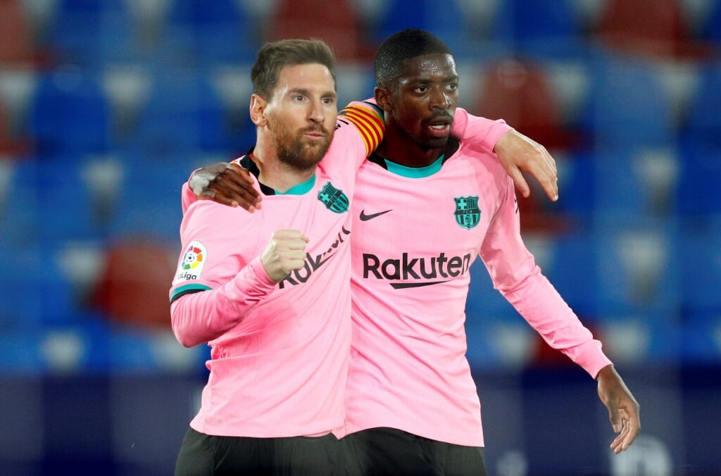 2021-05-11 19:53:58 epa09192443 FC Barcelona's Lionel Messi (L) celebrates with teammate Ousmane Dembele after scoring the 0-1 during the Spanish LaLiga soccer match between Levante UD and FC Barcelona at Ciutat de Valencia stadium in Valencia, eastern Spain, 11 May 2021.  EPA/Juan Carlos Cardenas