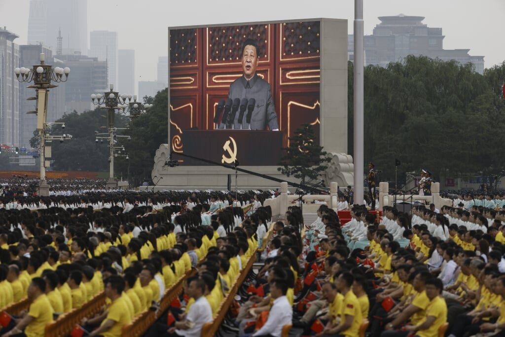 President Xi Jinping, hier gezien op een groot scherm. 